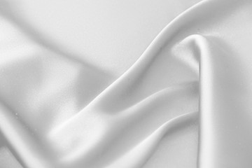 Rippled white silk fabric satin cloth waves background