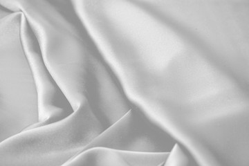 Naklejka na ściany i meble Rippled white silk fabric satin cloth waves background