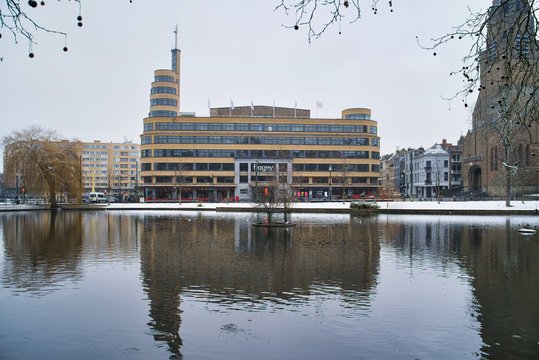 BRUSSELS, BELGIUM - JANUARY 30, 2019: Flagey building and tower along Ixelles lakes. Art nouveau architecture of the Flagey building along the lakes of Ixelles
