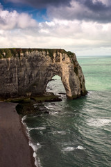 Fototapeta na wymiar he famous white natural cliffs Aval of Etretat and beautiful famous coastline, Normandy, France, Europe