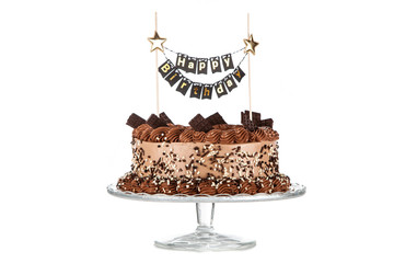 Decorated chocolate cake on dark background
