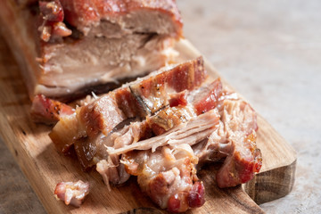 Baked carameled pork belly on a board