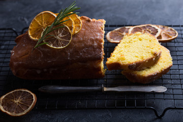 Homemade orange fruit loaf cake with citrus candied fruits and nuts. Traditional treat for tea for Breakfast. Pound cake. Selective focus