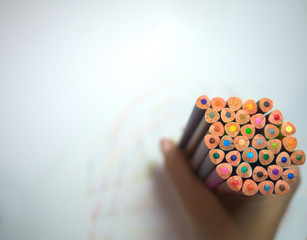 palette of pencils in hand
