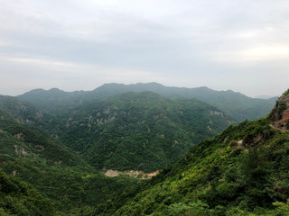 Fototapeta na wymiar Mountain landscape. Green hills in China. Chinese landscapes.