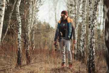Fototapeta premium Man with binoculars in the forest