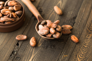  cacao nibs cacao beans on old wooden background