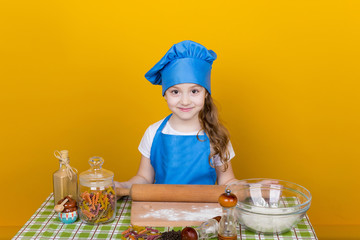 Little baker. Pretty cook kneads dough