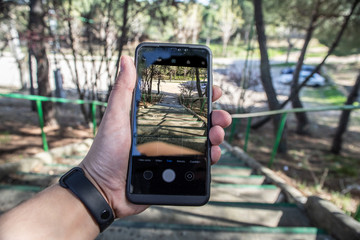 Taking a picture with the phone in the first person