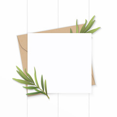 Flat lay top view elegant white composition letter kraft paper envelope nature tarragon leaf plant on wooden background