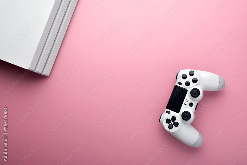 Poster computer game player. gaming concept. white joystick and conor of computer on pink background.