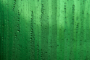 Original and interesting texture, pattern and background of transparent glass with drops of water from the rain on the surface of the glass , matrix