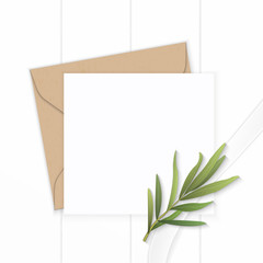 Flat lay top view elegant white composition letter kraft paper envelope tarragon leaf and silk ribbon on wooden background