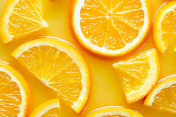 orange slices on juice background