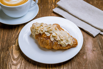the almond croissant with a cappuccino