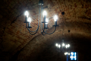 Lights in an old castle corridor