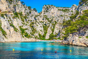 Sporty kayakers exercising in the bay of Calanques National Park