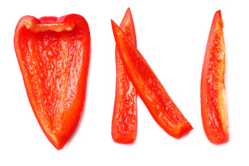 cut slices of red sweet bell pepper isolated on white background top view