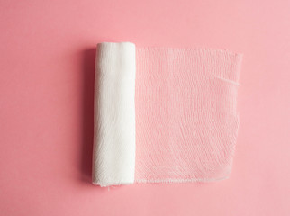 Medical bandage on a pink background
