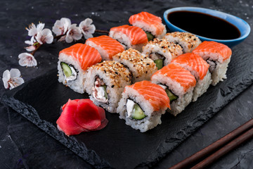 Philadelphia roll with salmon, cucumber, cream cheese and ginger. Traditional japanese food.
