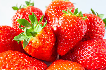 close-up bunch of fresh, ripe, bright red strawberries, macro