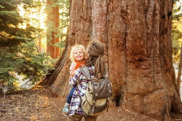 Fototapeta na wymiar Family with boy visit Sequoia national park in California, USA