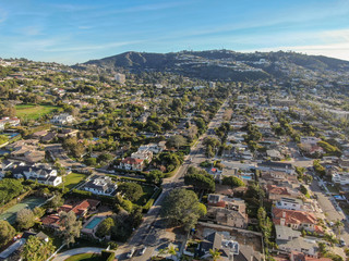 Aerial view of La Jolla little coastline city with nice beautiful wealthy villas with swimming pool. La Jolla, San Diego, California, USA.  West coast real estate development.