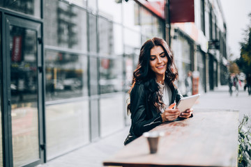 Young pretty spanish woman in cafe in city centre