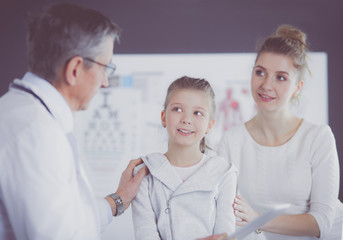 Fototapeta premium Little girl with her mother at a doctor on consultation