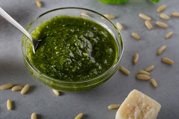 Pesto in a glass bowl with selective focus