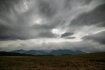 Obraz premium storm clouds over fields in slovakia