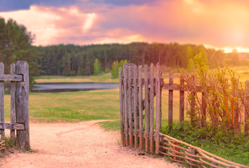 Obraz premium Sunset sky with clouds over forest and river.