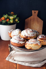 Freshly baked cinnamon buns with spices and cocoa filling. Sweet Homemade Pastry, dessert.
