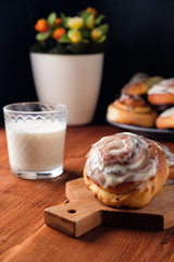 Freshly baked cinnamon buns with spices and cocoa filling. Sweet Homemade Pastry, dessert.