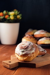 Freshly baked cinnamon buns with spices and cocoa filling. Sweet Homemade Pastry, dessert.