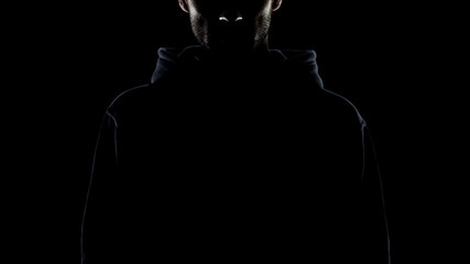 Bearded man invisible in night darkness, secret gangster, lawless intention