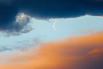 Obraz na płótnie Canvas moon crescent on cloudy sky