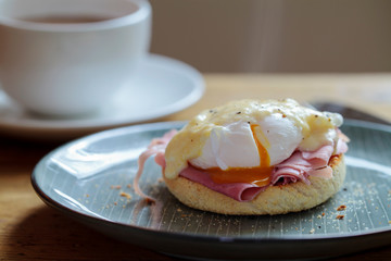 Egg benedict: poached egg and ham on english muffin