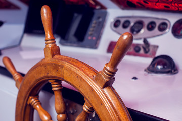 Steering wheel and control panel on a yacht.