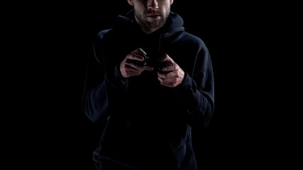 Nervous person playing console computer game, addiction to virtual reality