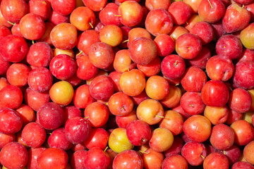 pile of plums in the market