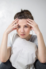 Portrait of beautiful woman has headaches. White background