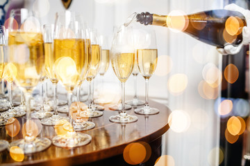 Champagne glasses on sparkling background.