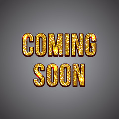 Coming soon gold glitter text on dark background