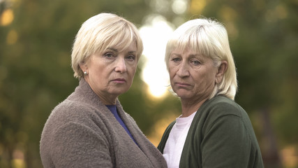 Frustrated women with sorrow in eyes supporting each other, family loss, life