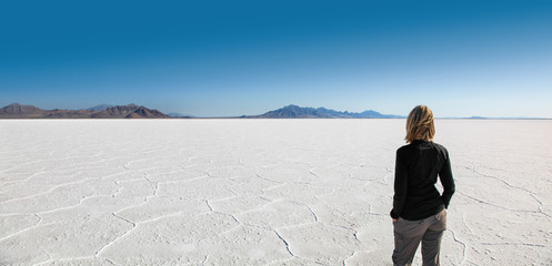 Woman enjoying stark beauty of the Bonneville Salt Flats