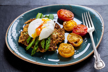 Courgette rosti, poached egg, asparagus and roast tomatoes