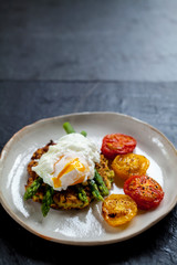 Courgette rosti, poached egg, asparagus and roast tomatoes
