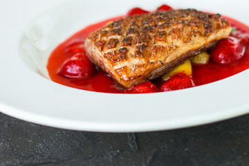 duck breast roasting, vegetables, berry sauce and microgreen (main dish). food background. top view