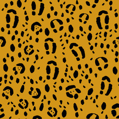 Seamless animal print, black spots on an orange background. Stock vector illustration.